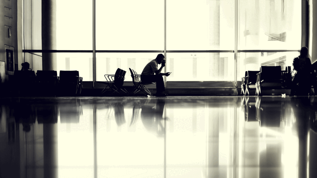  People waiting at airport for flight.