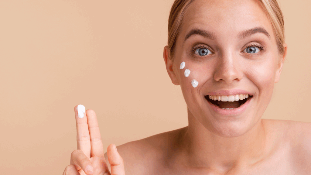 Girl applying  sunscreen on pimple