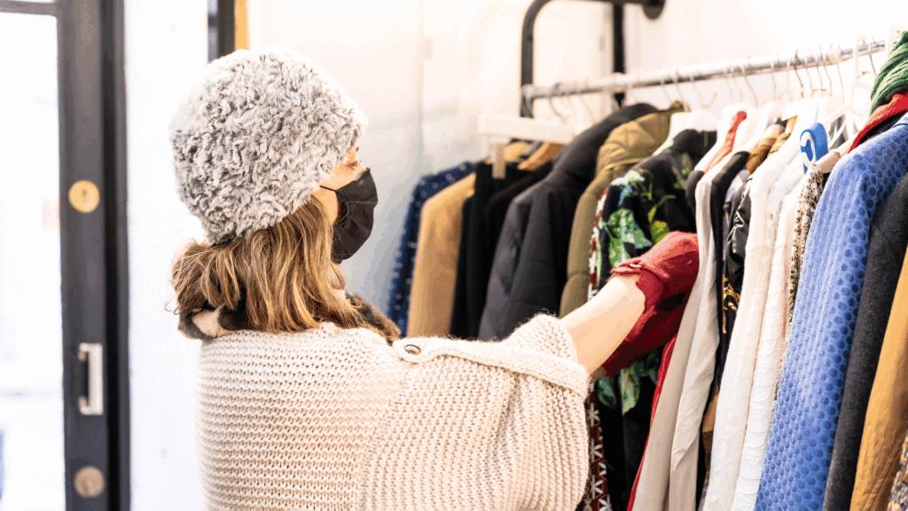 woman buying used clothes.